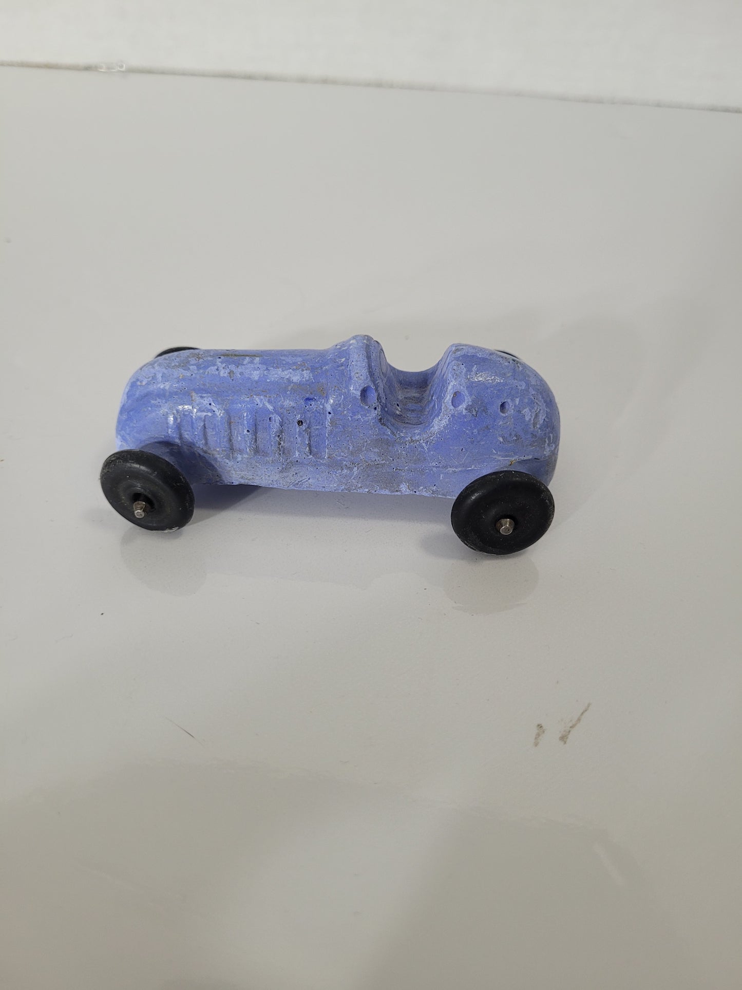 Vintage Blue Chalkware Race Car Toy with Black Wheels – 3" x 1.5"