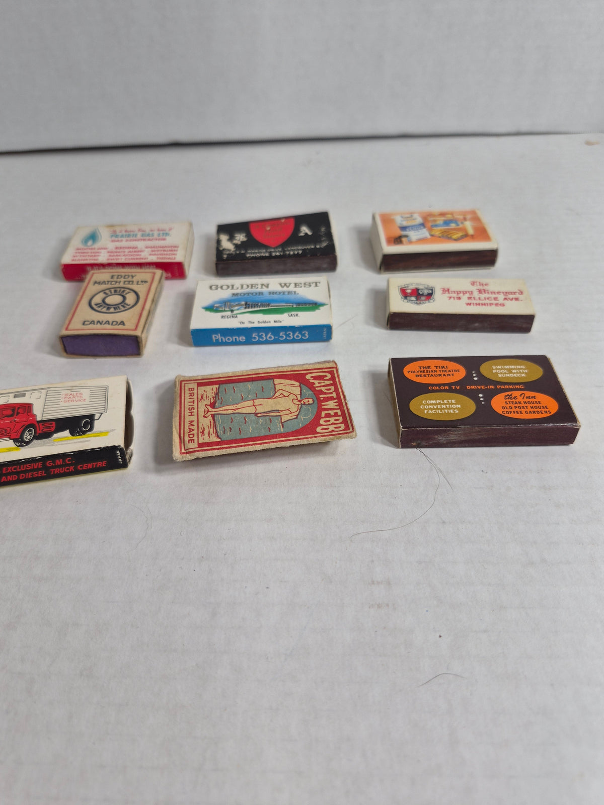 Vintage Advertising Matchboxes, Lot of 9 – Golden West & Regina Inn Regina, Prairie Gas, GMC Stern Trucks Winnipeg, Bryant & May Capt. Webb, Happy Vineyard