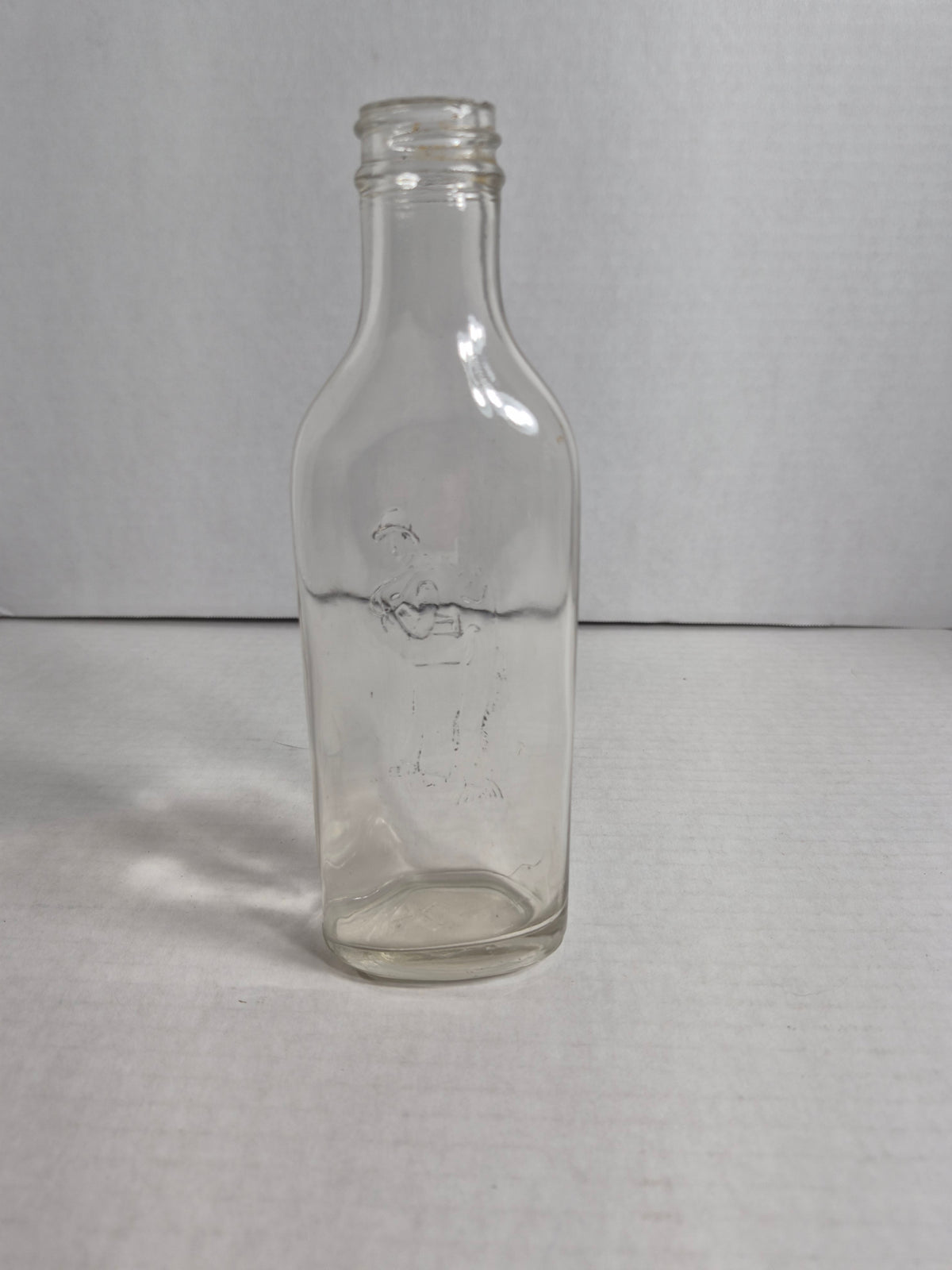 Scott's Emulsion Fisherman Bottle – Embossed Fisherman Carrying a Cod – Clear Glass Cod Liver Oil Bottle – Scott & Bowne