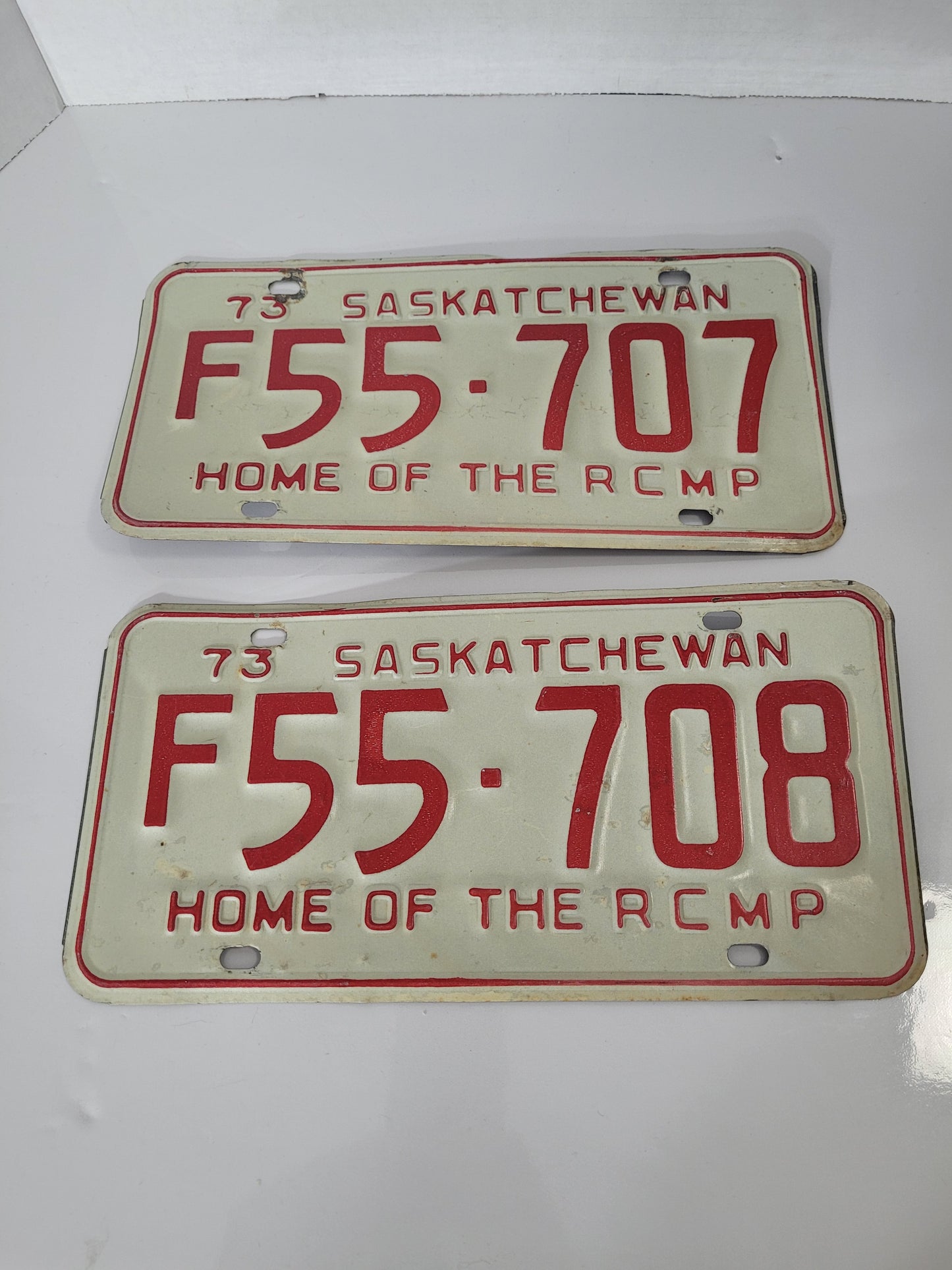 Rare Consecutive 1973 Saskatchewan “Home of the RCMP” Licence Plates – F55-707 & F55-708