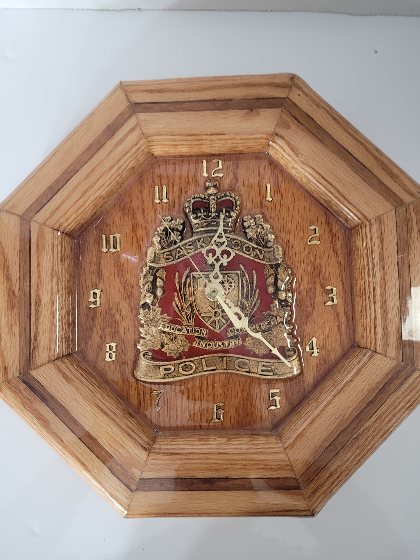 Handcrafted Saskatoon Police Crest Oak Wall Clock by Ron Oliver – 13" × 13"