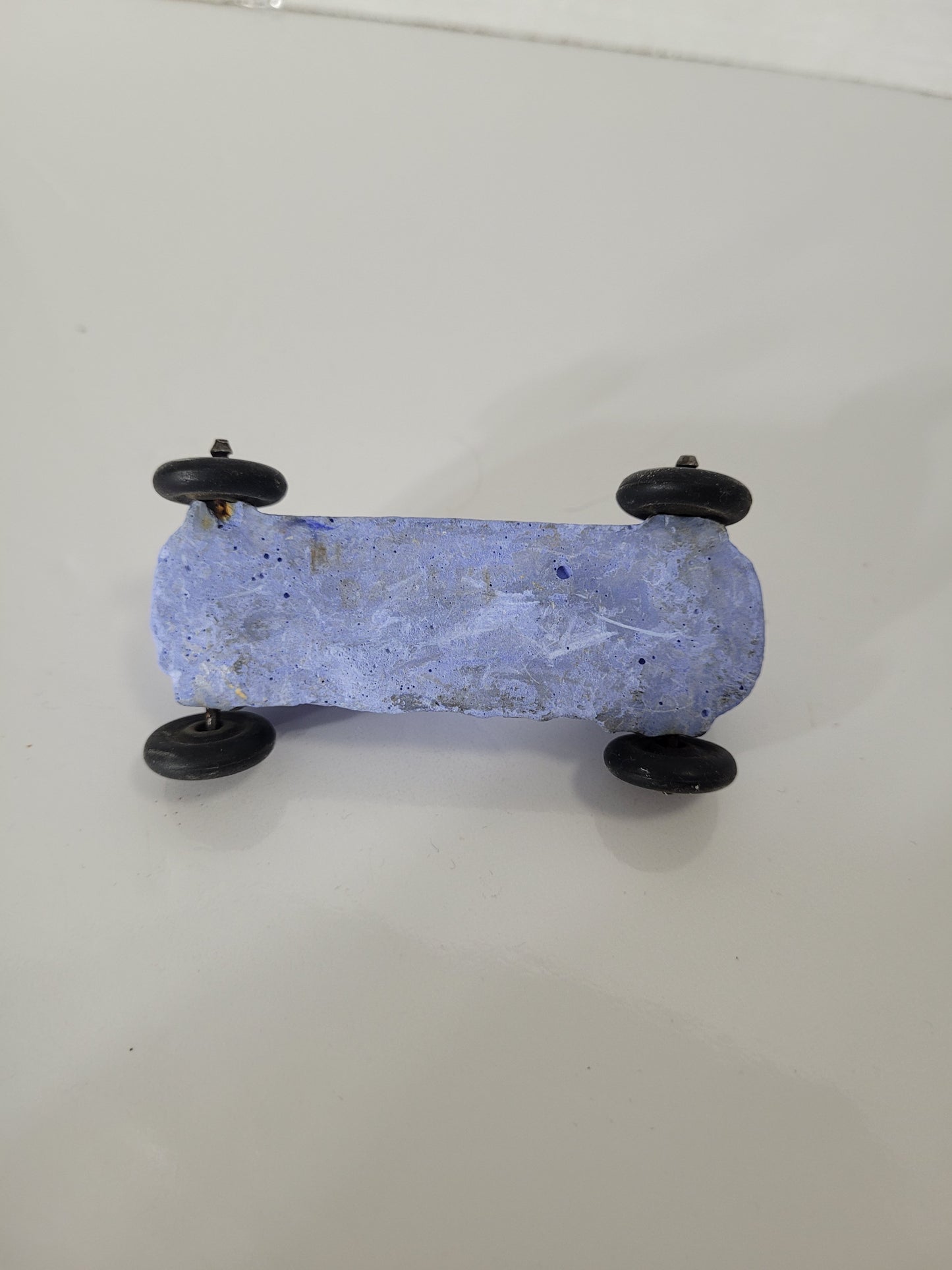 Vintage Blue Chalkware Race Car Toy with Black Wheels – 3" x 1.5"
