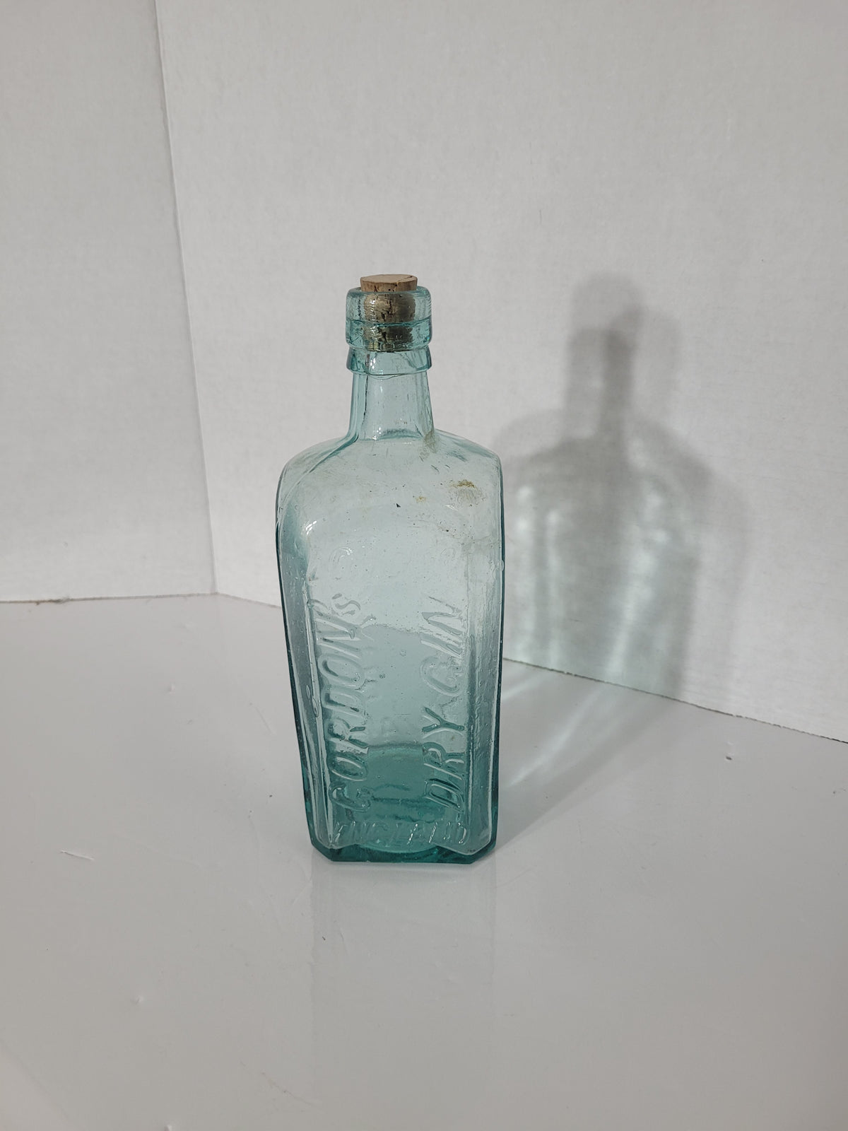 Antique Gordon’s Dry Gin Aqua Glass Bottle – London England – Embossed Boar Mark – c.1910s–1920s