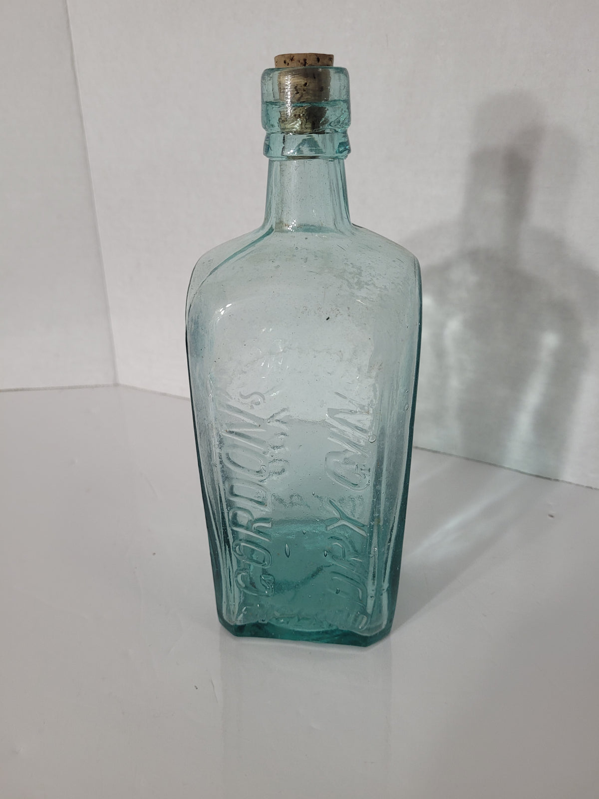 Antique Gordon’s Dry Gin Aqua Glass Bottle – London England – Embossed Boar Mark – c.1910s–1920s