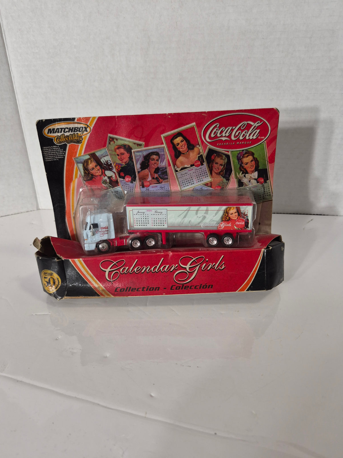 Matchbox Collectibles Coca-Cola Calendar Girls Semi Truck – Box Had a Run-In with a Pepsi Driver  Description