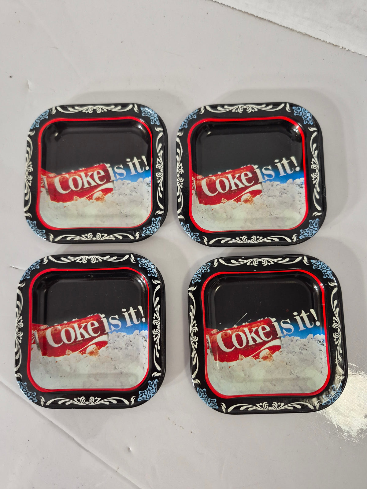 Vintage Coca-Cola “Coke Is It!” Mini Metal Trays/Coasters – Set of 4