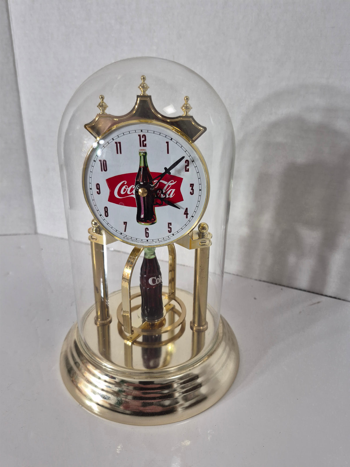 Vintage 1997 Coca-Cola Glass Dome Anniversary Clock – Spinning Bottle Display  Description
