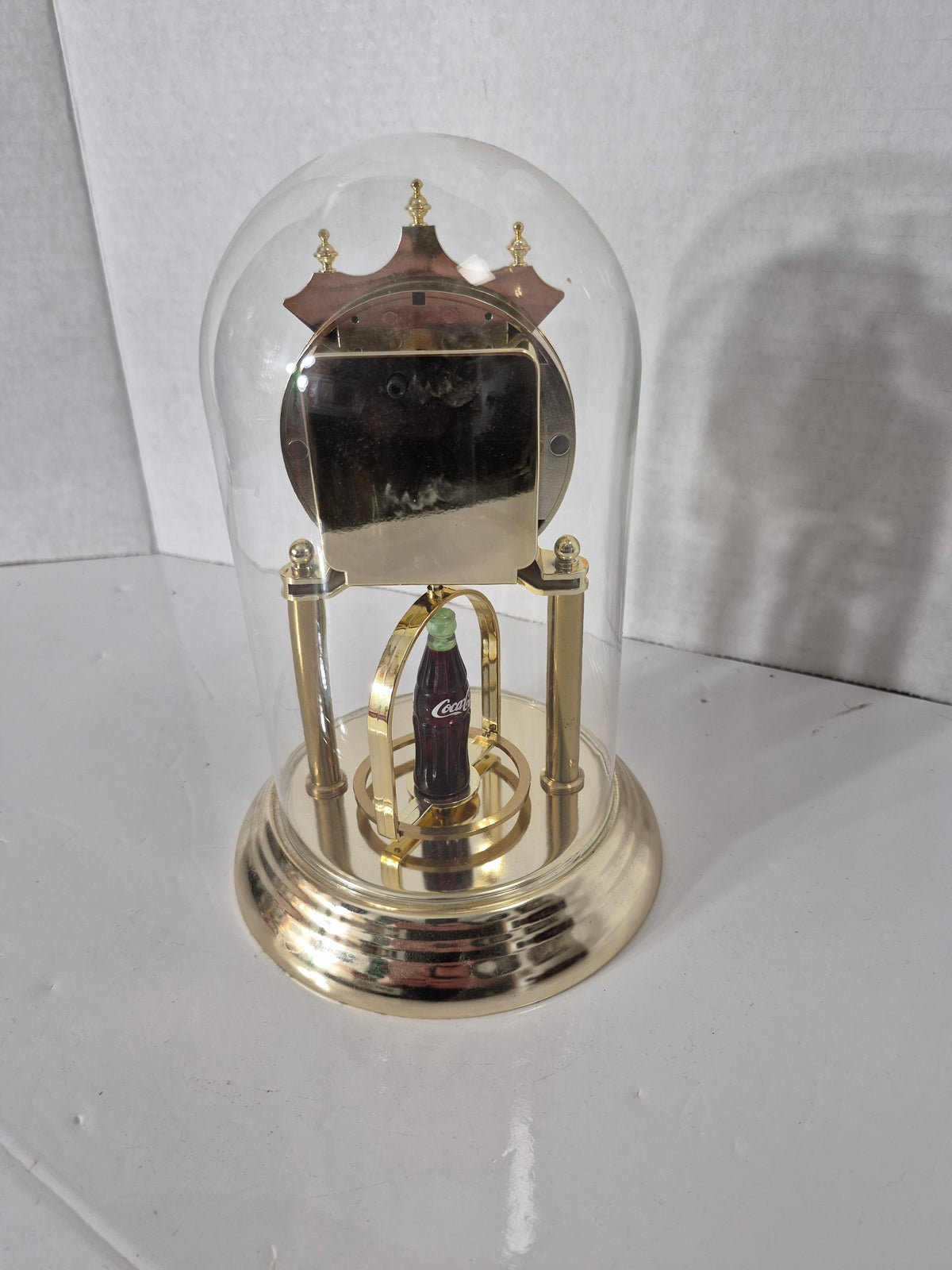 Vintage 1997 Coca-Cola Glass Dome Anniversary Clock – Spinning Bottle Display  Description