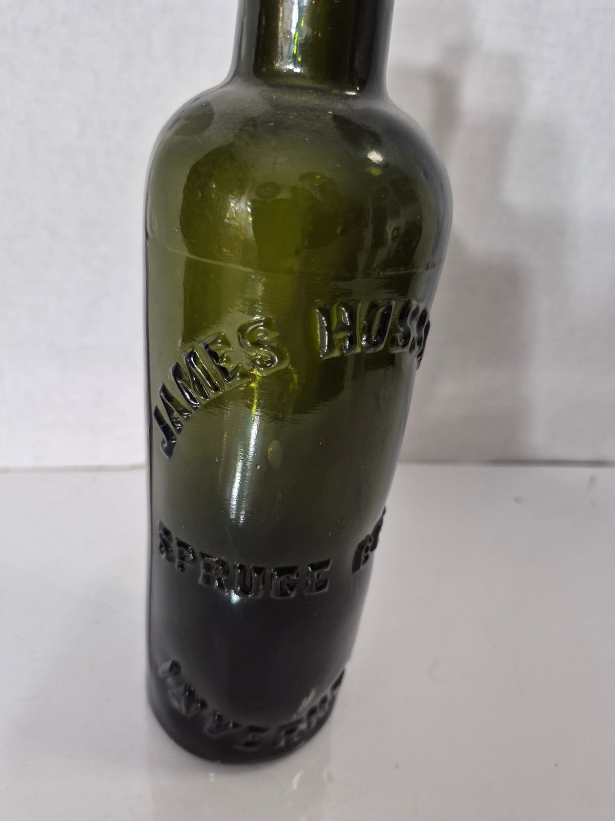 Antique James Hussey’s Spruce Beer Bottle – Olive Green Embossed Glass – Quebec