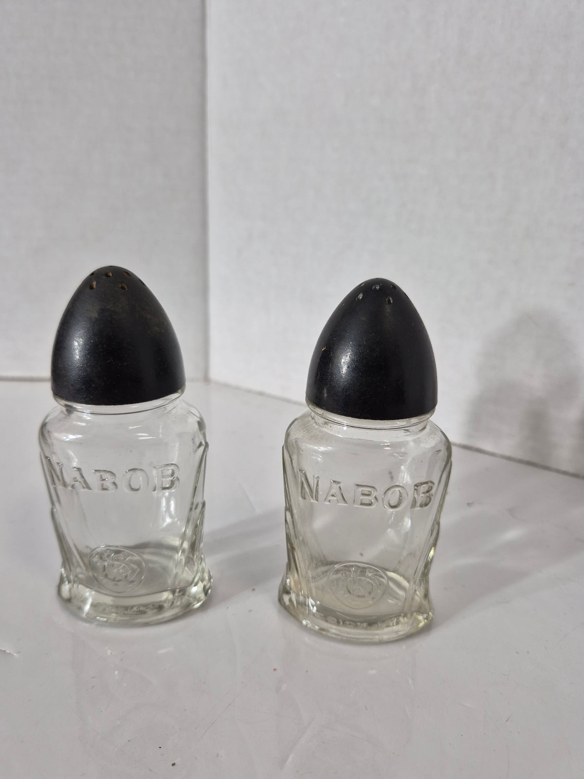 Vintage NABOB Glass Salt & Pepper Shakers – Black Bakelite-Style Tops – 4.5"