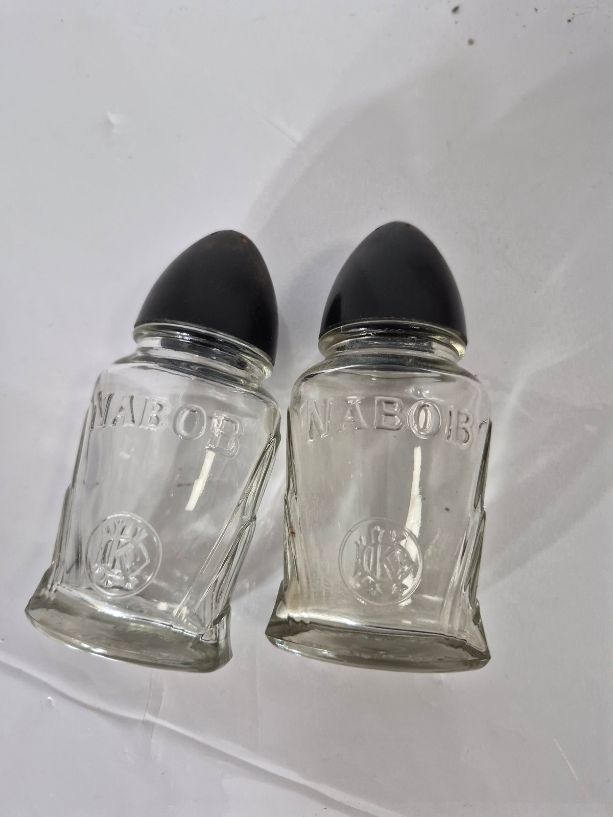 Vintage NABOB Glass Salt & Pepper Shakers – Black Bakelite-Style Tops – 4.5"