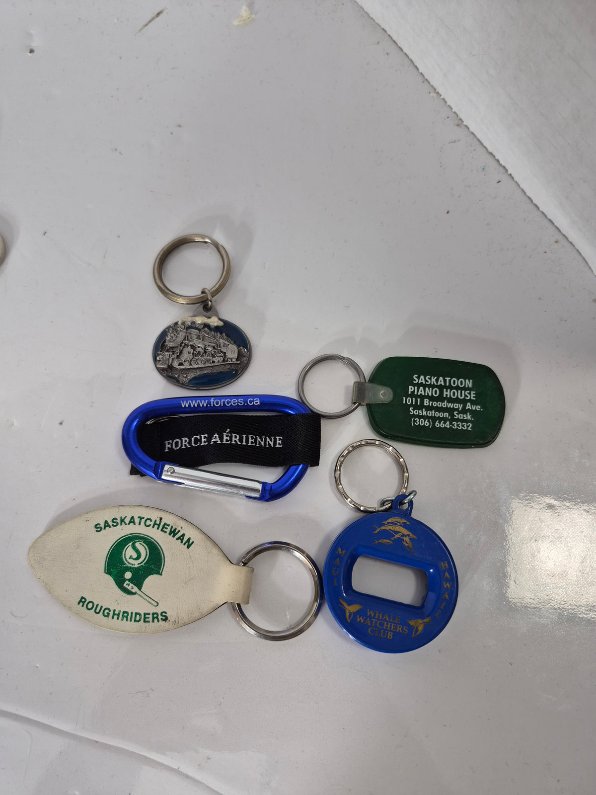 Vintage Keychain Lot of 5 – Saskatchewan Roughriders, Canadian Air Force, Steam Train, Saskatoon & Maui Souvenirs