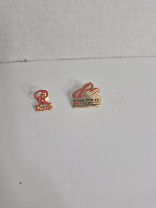 Alberta Distillers '92 Calgary Stampede Pin + Rainier Beer Pin — 2-Pin Breweriana Set
