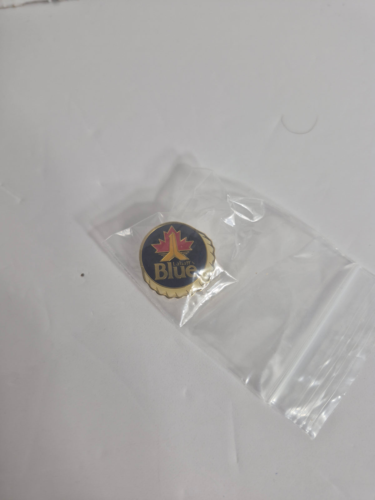 Labatt's Blue Lapel Pin — Bottle Cap Shape with Maple Leaf, 1 Inch