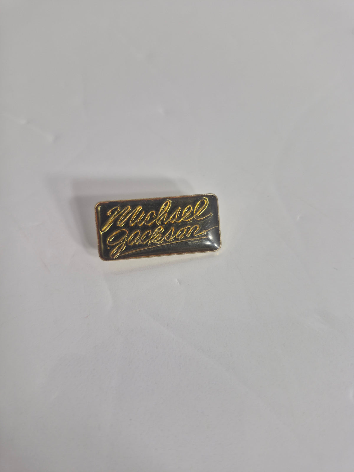 Vintage Michael Jackson Script Logo Enamel Lapel Pin — Gold on Black, King of Pop Music Memorabilia, 1" x 0.5"