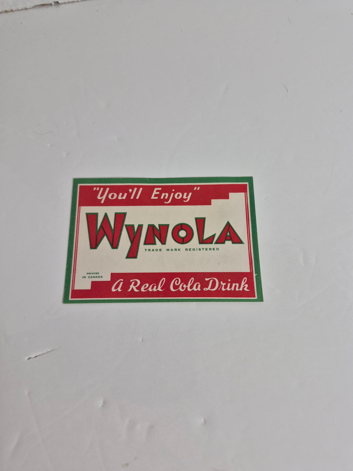 Wynola Cola Paper Bottle Label — "You'll Enjoy — A Real Cola Drink" — Printed in Canada — Vintage Soda Advertising