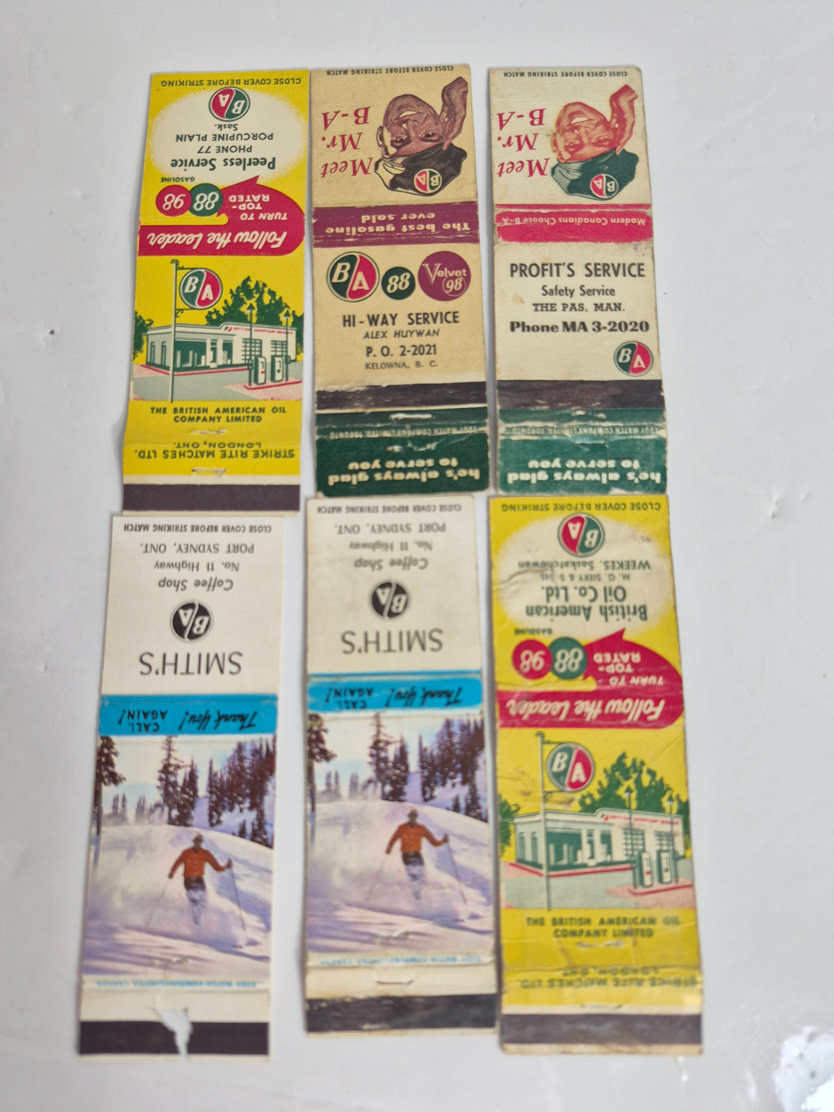 B-A British American Oil Matchbook Cover Lot of 6 – "Meet Mr. B-A" & "Follow the Leader" Dealer Covers: Porcupine Plain & Weekes Sask., The Pas Man., Kelowna B.C., Port Sydney Ont.