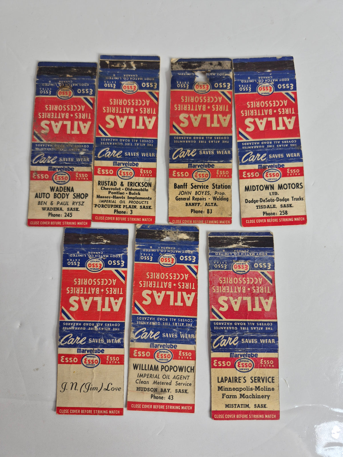 Esso / Imperial Oil "Atlas Tires" Matchbook Covers – Lot of 7 Dealer Covers – Wadena, Porcupine Plain, Tisdale, Hudson Bay & Mistatim, Sask. – Banff, Alta.
