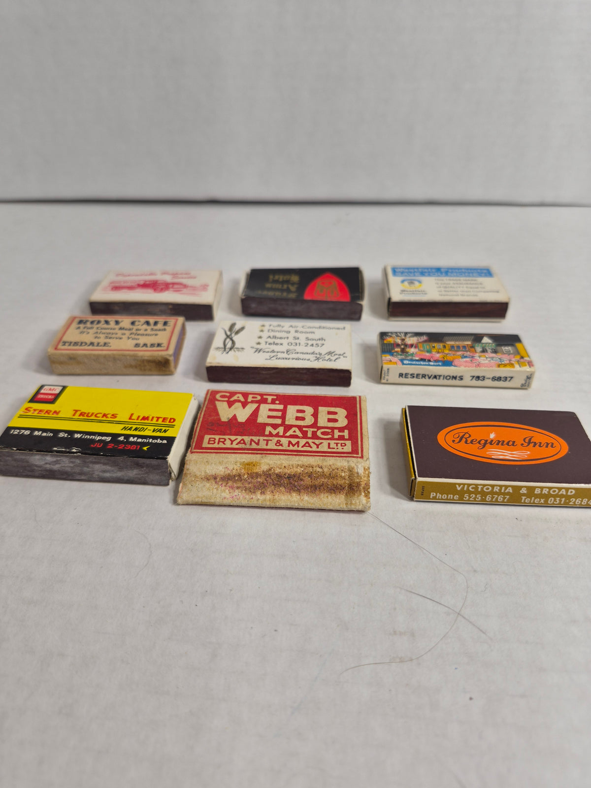 Vintage Advertising Matchboxes, Lot of 9 – Golden West & Regina Inn Regina, Prairie Gas, GMC Stern Trucks Winnipeg, Bryant & May Capt. Webb, Happy Vineyard