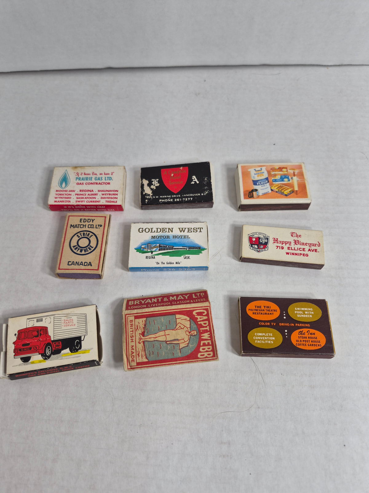 Vintage Advertising Matchboxes, Lot of 9 – Golden West & Regina Inn Regina, Prairie Gas, GMC Stern Trucks Winnipeg, Bryant & May Capt. Webb, Happy Vineyard