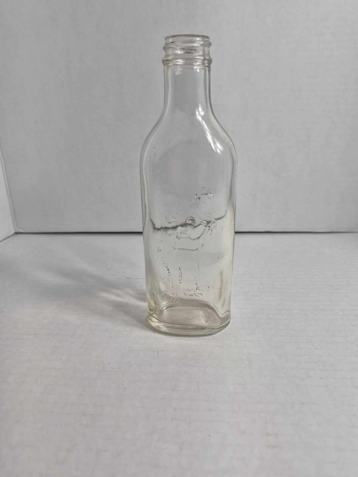 Scott's Emulsion Fisherman Bottle – Embossed Fisherman Carrying a Cod – Clear Glass Cod Liver Oil Bottle – Scott & Bowne